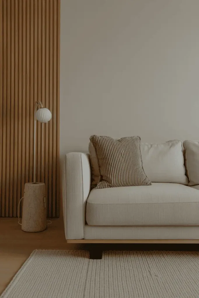 Quiet minimalist living room detail with layered wood tones and neutral textures, calm reflective mood, editorial interior photography, high resolution, no people, no text, no watermark