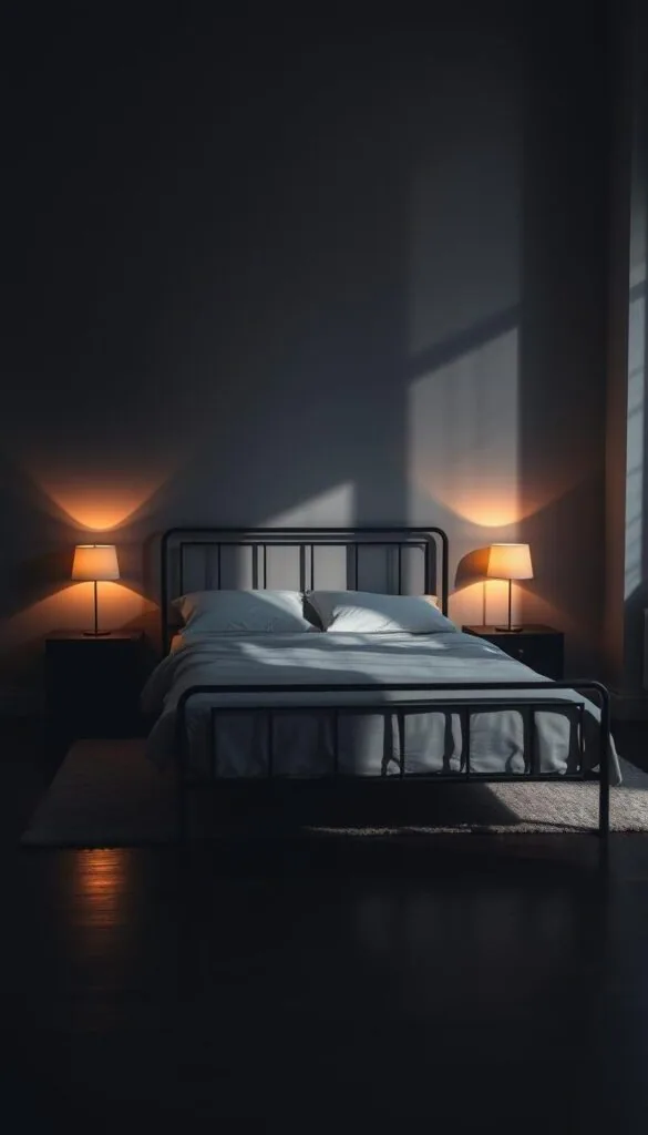 A dimly lit bedroom with a sleek black metal bed frame as the focal point. The frame casts dramatic shadows on the wall, creating a moody, atmospheric ambiance. A warm, soft light emanates from a pair of minimalist bedside lamps, their glow reflecting off the dark wood flooring. The room is sparsely decorated, allowing the bed frame to take center stage. Subtle textures, such as a plush rug and crisp white bedding, add depth and visual interest. The overall scene evokes a sense of modern, sophisticated elegance, perfect for elevating the bedroom's lighting and design. A dimly lit bedroom with a sleek black metal bed frame as the focal point. The frame casts dramatic shadows on the wall, creating a moody, atmospheric ambiance. A warm, soft light emanates from a pair of minimalist bedside lamps, their glow reflecting off the dark wood flooring. The room is sparsely decorated, allowing the bed frame to take center stage. Subtle textures, such as a plush rug and crisp white bedding, add depth and visual interest. The overall scene evokes a sense of modern, sophisticated elegance, perfect for elevating the bedroom's lighting and design.